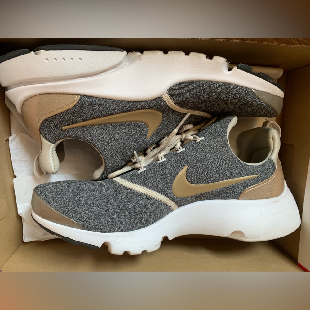 Black and gold Nikes